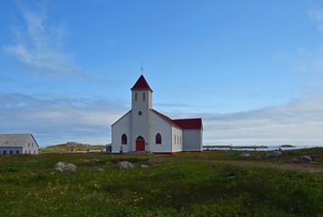 white church with red roof on Ile aux Marin, Saint Pierre and Miquelon