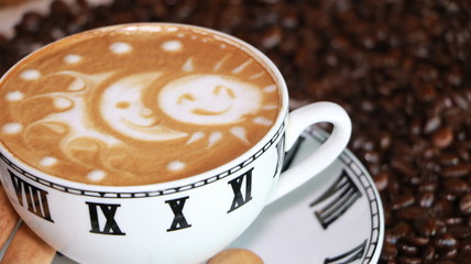 cup of coffee on grains with drawing on coffee