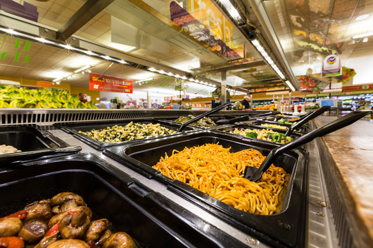 MADISON, NJ, UNITED STATES - FEBRUARY 13, 2014: Salad bar in an American supermarket. Health-conscious consumers are generally willing to pay more for food that they believe is healthy for them
