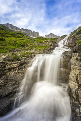 Obraz na płótnie Canvas waterfall in the mountains glacier national park