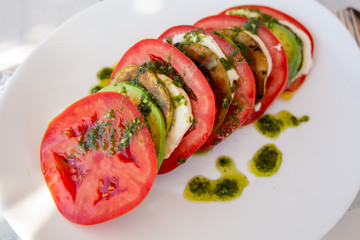 salad with tomatoes, mozzarella, avocado and grilled zucchini