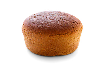 Fresh baked tasty delicious rye ruddy round bread with toasted crust isolated on a white background