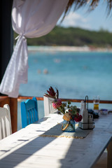 table and chairs on the beach
