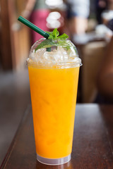 Orange juice in glass plastic