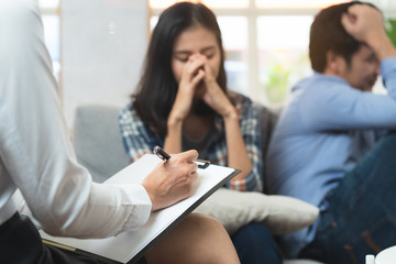 psychologist talking with married couple about depression of husband.