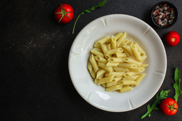 pasta penne and tomato sauce - delicious second course, menu concept. food background. copy space