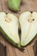 pear split in two on wood board