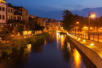 Fototapeta na wymiar Bydgoszcz by night. Old buildings on the river Brda. A place called Bydgoszcz Venice