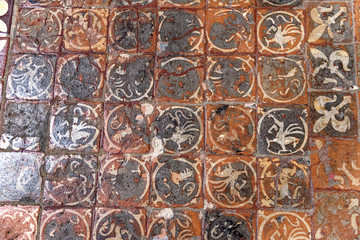 Medieval painted stone floor tiles inside Winchester Cathedral, Hampshire, England