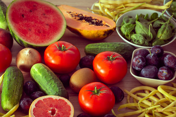 healthy diet, kitchen table full of fruits and vegetables