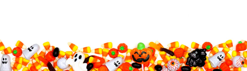 Halloween candy long border. Top view isolated on a white background.