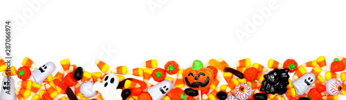 Halloween candy long border. Top view isolated on a white background.