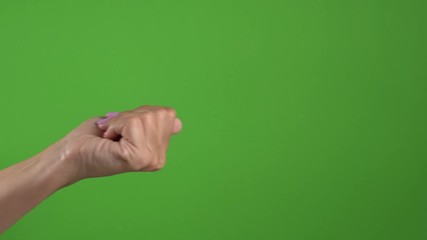 Closeup side view of beautiful female hand making gesture Come closer. Woman beckoning somebody. Real time 4k video footage.