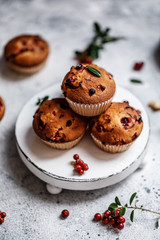 Freshly baked cowberry muffins. Cranberry muffins with fresh berries on rustic background. Copy space.