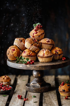 Freshly baked cowberry muffins. Cranberry muffins with fresh berries on rustic background. Copy space.