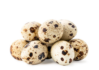 Obraz premium Pile of quail eggs on a white, isolated.