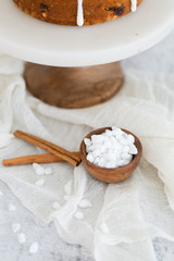 Cinnamon sticks and wooden bowl of belgian pearl sugar, cake ingredients 