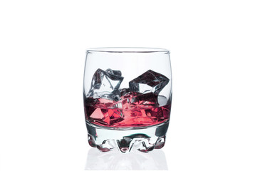 A glass of whiskey with ice cubes on a white background.