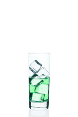 .Glass beaker is filled with a blue cocktail ice cubes on a white background.