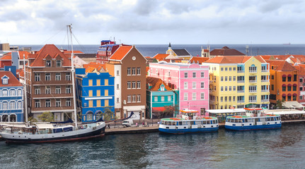 Historic buildings overlook the harbor in Curacao