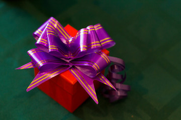 box with a gift on a green background