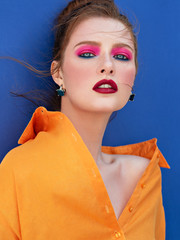 Fashion portrait of red haired woman.