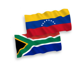 National vector fabric wave flags of Venezuela and Republic of South Africa isolated on white background. 1 to 2 proportion.