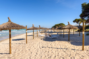 Umbrellas at the Playa de Muro beach in Mallorca, Spain