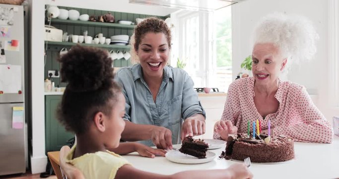 Three generations of family celebrating a birthday together