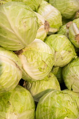 Fototapeta na wymiar Fresh organic vegetables flatlay. Cabbage background. Great vegan snack ingredient.