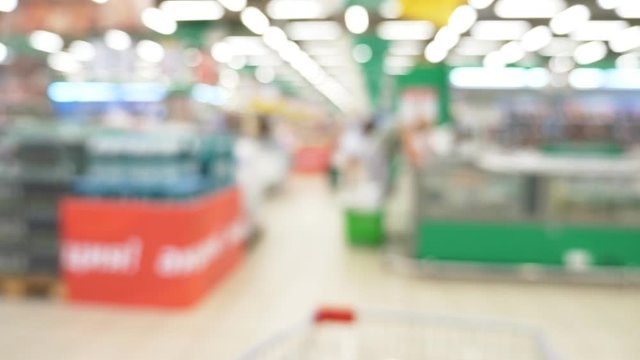 People at the supermarket, blurred background. buyers choose products in the supermarket.