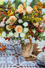Autumn flowers decor, cream beige roses with fall berries