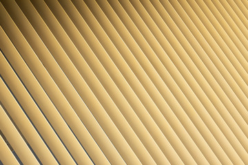 Angle view of beige or golden 3d stripes. Louvre shutters like pattern.