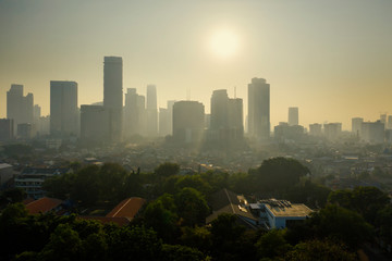 Fototapeta na wymiar Air polluted Jakarta city at morning time