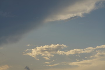 Fototapeta na wymiar Blue orange grey cloudy sky