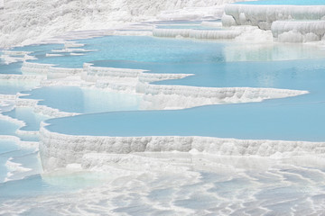 Pamukkale travertines pools and terraces. Denizli, Turkey. Natural site of hot springs and travertines, terraces of carbonate minerals.