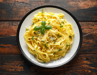 Pasta al Limone, Lemon with basil and parmesan cheese on wooden table