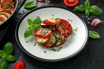 Ratatouille Vegetable Stew with zucchini, eggplants, tomatoes, garlic, onion and basil. Traditional French food.