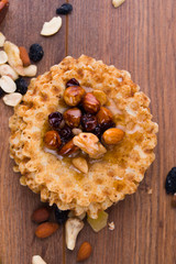 Tasty and healthy honey with nuts on the table.