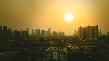 Dense buildings in Jakarta city at sunset time