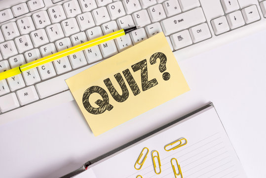 Text sign showing Quiz Question. Business photo text test of knowledge as competition between individuals or teams Empty orange square papers by the pc keyboard with copy space