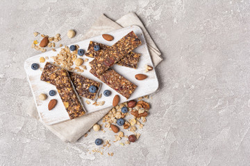 Granola bar with fresh blueberry and nuts for healthy nutrition