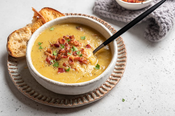 Lentil pea soup garnish with bacon and pork ribs