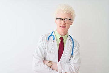 Young albino doctor man wearing stethoscope standing over isolated white background happy face smiling with crossed arms looking at the camera. Positive person.