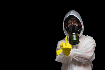 The concept of toxic environmental pollution. A man in a gas mask shows a fuck you gesture....