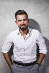 Handsome bearded man wearing white shirt