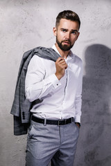 Handsome bearded man wearing gray suit