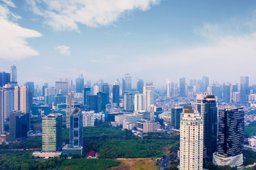 Jakarta downtown with air polluted under blue sky