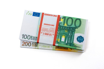 Euro cash in bundles of one hundred and two hundred banknotes, Euro money Euro on a white background, isolated on a white background