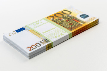 Euro cash in bundles of one hundred and two hundred banknotes, Euro money Euro on a white background, isolated on a white background